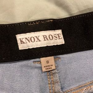 Knox Rose, size 8, faded blue jeans with the colorful pinstripe down the side.